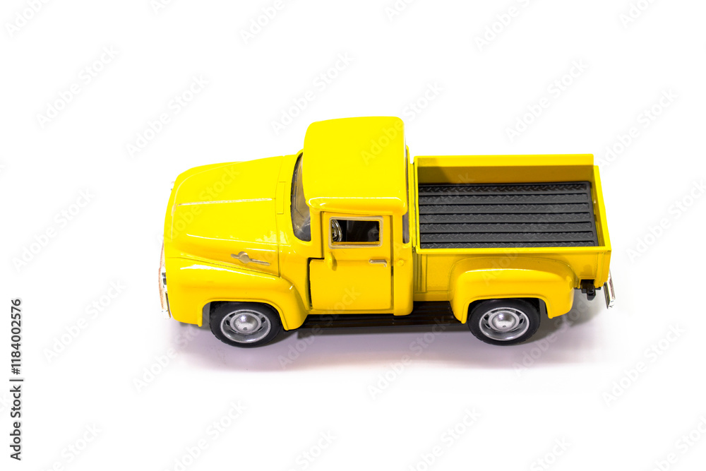 Yellow pickup truck toy isolated on white background. Children's toys. Transport concept Yellow pickup truck toy isolated on white background. Children's toys. Transport concept