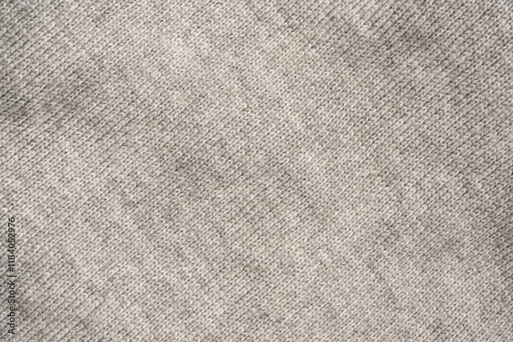Grey wool sweater texture as a background. Grey wool sweater texture as a background.