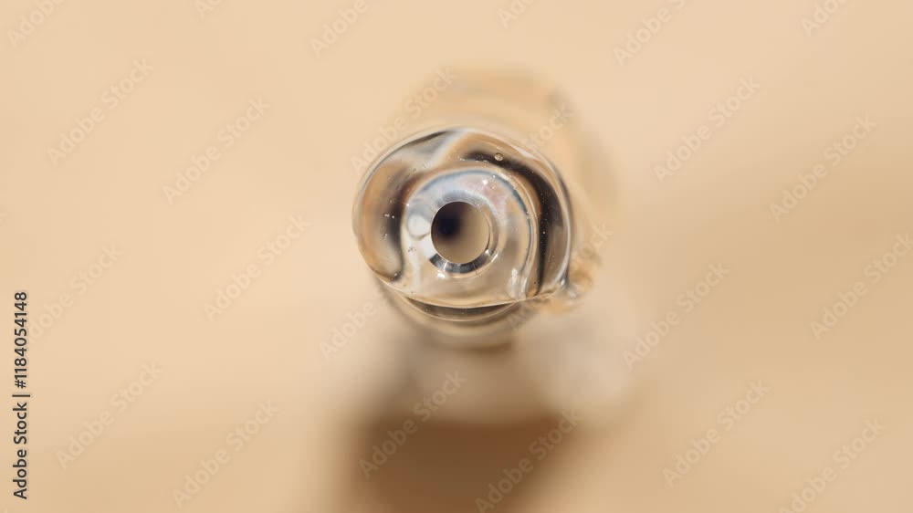 Part of the pipette with pouring hyaluronic acid, top view.