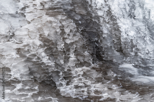 Frozen mountain spring close-up in Kegety gorge in Kyrgyzstan. Ice background. photo