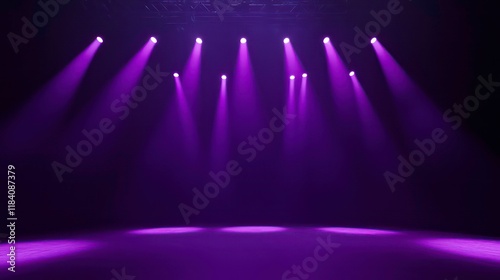 Purple stage lighting illuminates a dark room, creating dramatic beams of light.