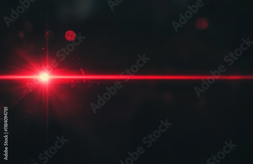 Red laser beam on black background, abstract glowing light effect with lens flare and bokeh