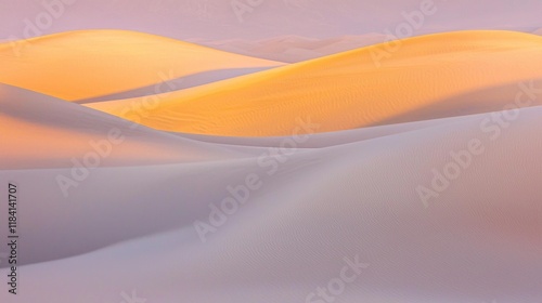 Soft pastel dunes emerge as waves against the twilight sky, embracing the warm glow of dusk. The gentle curves create a serene landscape, inviting contemplation and tranquility photo