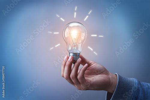 Hand with glowing bulb innovation and inspiration in simple elegance