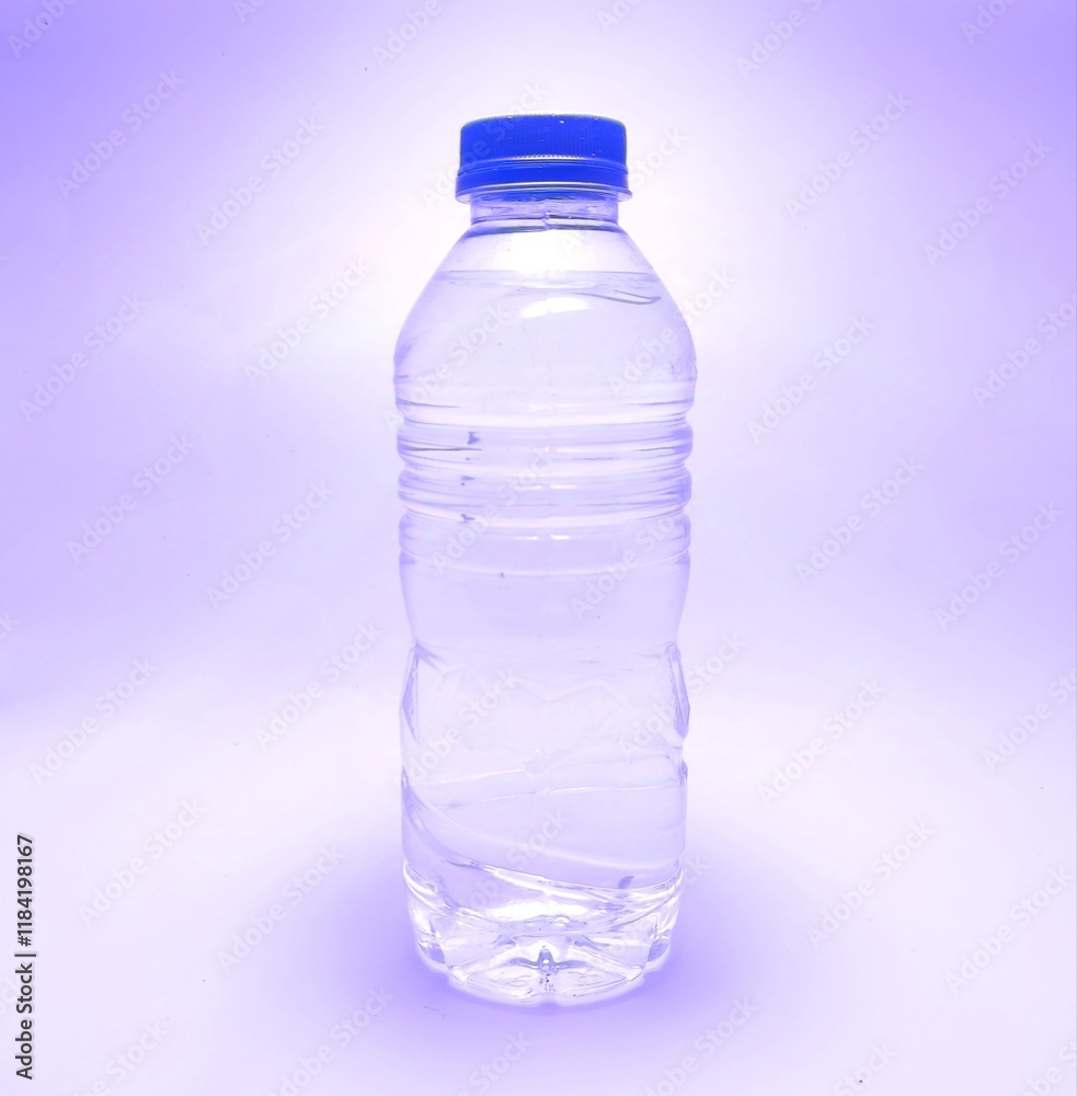 Naklejka premium A bottle filled with drinking water background blue