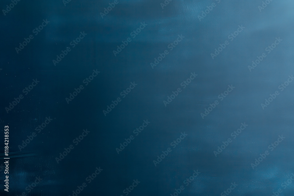 Obraz premium A smooth, dark blue surface with subtle texture, evoking a sense of calm and depth.
