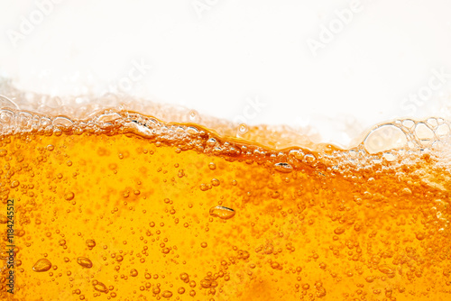 Close up bright orange Oil or beer splash texture and nature waves, Beautiful waves curve and little bubbles smooth for graphic design and background, Oil Bubbles, Soft beer bubbles, Selective focus