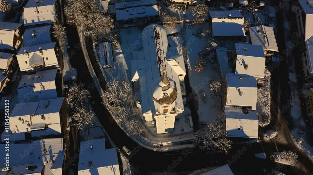 St. Martin, the Catholic parish church in Garmisch, part of Garmisch-Partenkirchen, Germany, is shown in an aerial view, nestled in a picturesque winter landscape, highlighting its beauty from above. St. Martin, the Catholic parish church in Garmisch, part of Garmisch-Partenkirchen, Germany, is shown in an aerial view, nestled in a picturesque winter landscape, highlighting its beauty from above.