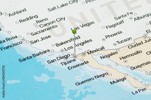 Macro photo of a green pin needle into Tijuana city of Mexico political map 