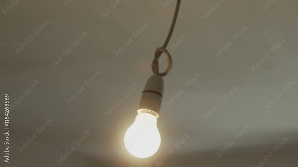 Light bulb swaying on the ceiling stock footage