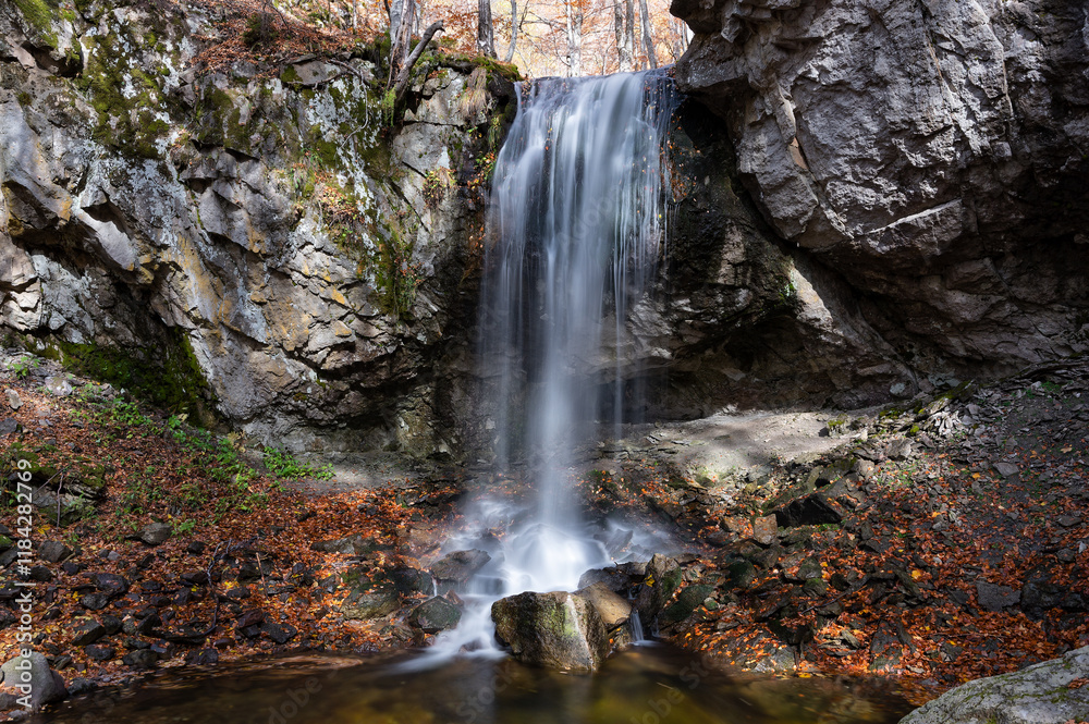 Fototapeta premium View of the waterfall of Achladochori in the virgin forest of Frakto in Macedonia, Greece