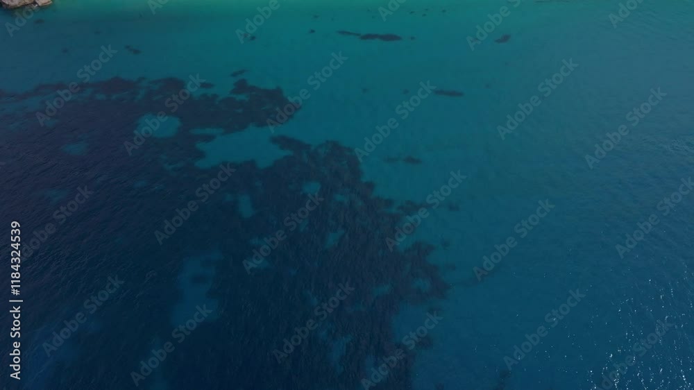 Aerial view of serene Mylos beach with clear blue water and scenic coastline, Agios Nikitas, Greece. Aerial view of serene Mylos beach with clear blue water and scenic coastline, Agios Nikitas, Greece.