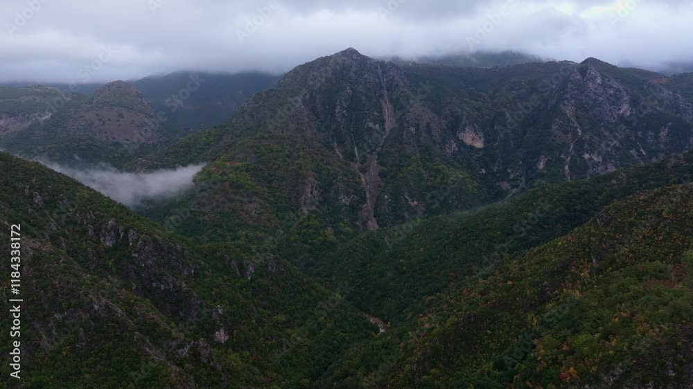 Aerial view of Acheron Springs with lush greenery and rugged mountains, Epirus, Greece. Aerial view of Acheron Springs with lush greenery and rugged mountains, Epirus, Greece.