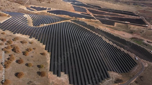 Aerial view of solar farm with photovoltaic panels in a beautiful landscape, Sideras, Greece. photo