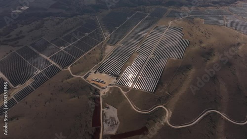 Aerial view of solar farm with photovoltaic panels in a beautiful landscape, Sideras, Greece. photo