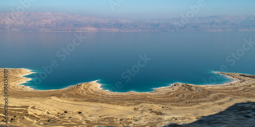 Panoramic view from a bus window of the brilliant blue color of the Dead  Sea and coastline north of Ein Bokek in Israel.
 photo