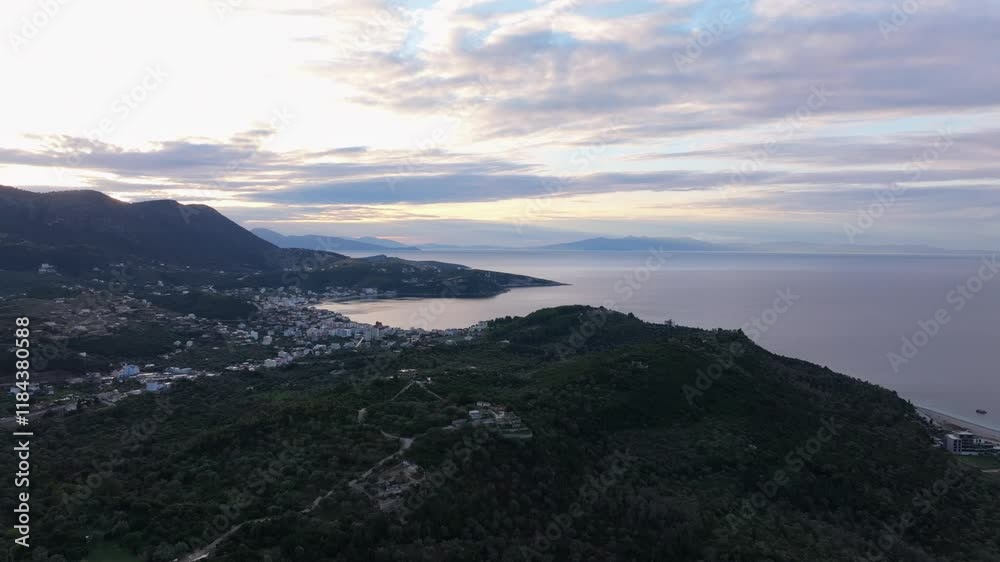 Aerial view of Himara Castle at sunrise overlooking the serene Mediterranean Sea and picturesque coastline, Himare, Albania. Aerial view of Himara Castle at sunrise overlooking the serene Mediterranean Sea and picturesque coastline, Himare, Albania.