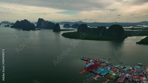 Aerial view of panyee floating village in a serene bay surrounded by islands and water, Phang Nga, Thailand. photo