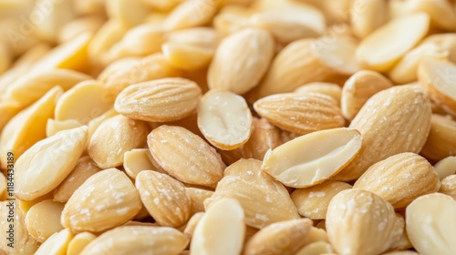 Close up view showcasing a pile of blanched almonds, highlighting the natural texture and color of the blanched almonds, perfect for culinary and health related visuals featuring blanched almonds. photo