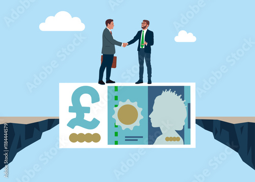 Businessmen handshake on money banknote after finish agreement. Pound sterling money bill bridging economy gap assisting business people to overcome financial difficulties. British money. Currency.