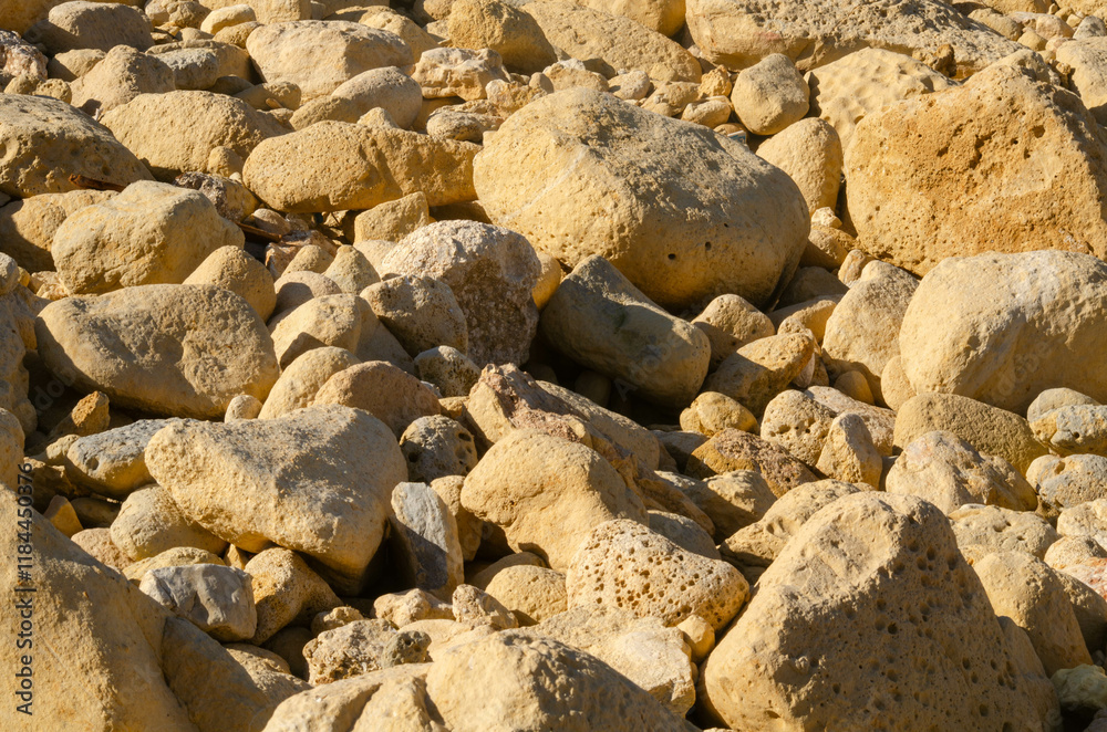 Textured Yellow Limestone Rocks Close-Up for Nature Backgrounds, of natural yellow limestone rocks, perfect for nature, geology, and texture,based designs Textured Yellow Limestone Rocks Close-Up for Nature Backgrounds, of natural yellow limestone rocks, perfect for nature, geology, and texture,based designs