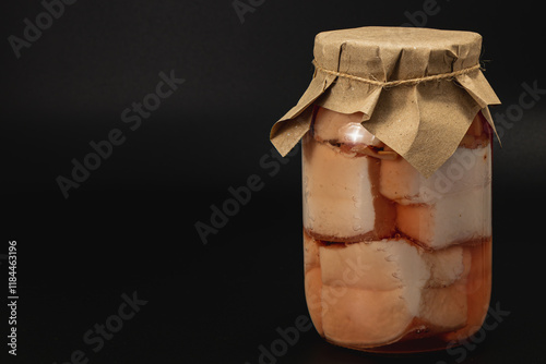 Salted lard with beans preserved in homemade canning jar photo