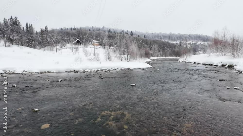 A serene winter river landscape features clear waters flowing through snowcovered banks with frosty trees, beautifully embodying the tranquility of a peaceful snowy day A serene winter river landscape features clear waters flowing through snowcovered banks with frosty trees, beautifully embodying the tranquility of a peaceful snowy day