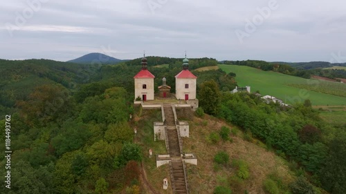 Aerial view of Calvary Ostre church surrounded by trees and hills, Ustek, Czech Republic. photo