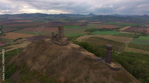 Aerial view of hazmburk castle ruins on a hill surrounded by scenic fields and valleys, Klapy, Czech Republic. photo