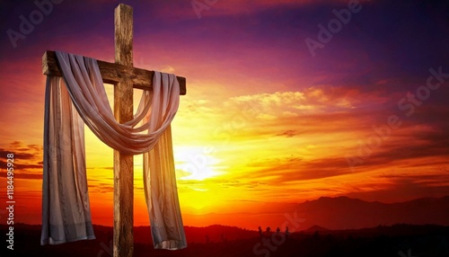 Cruz de madeira com pano branco ao pôr do sol