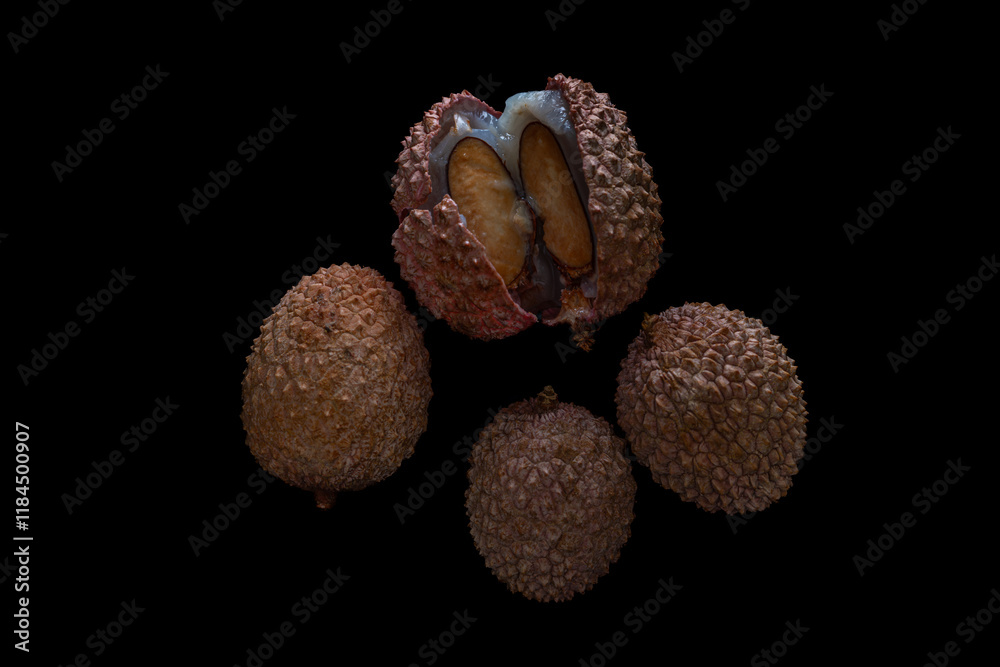 Lichi fruit with fresh juice on black table Lichi fruit with fresh juice on black table