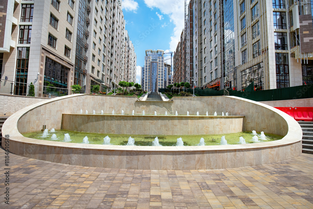 Modern urban oasis featuring dynamic water fountains in a vibrant city plaza