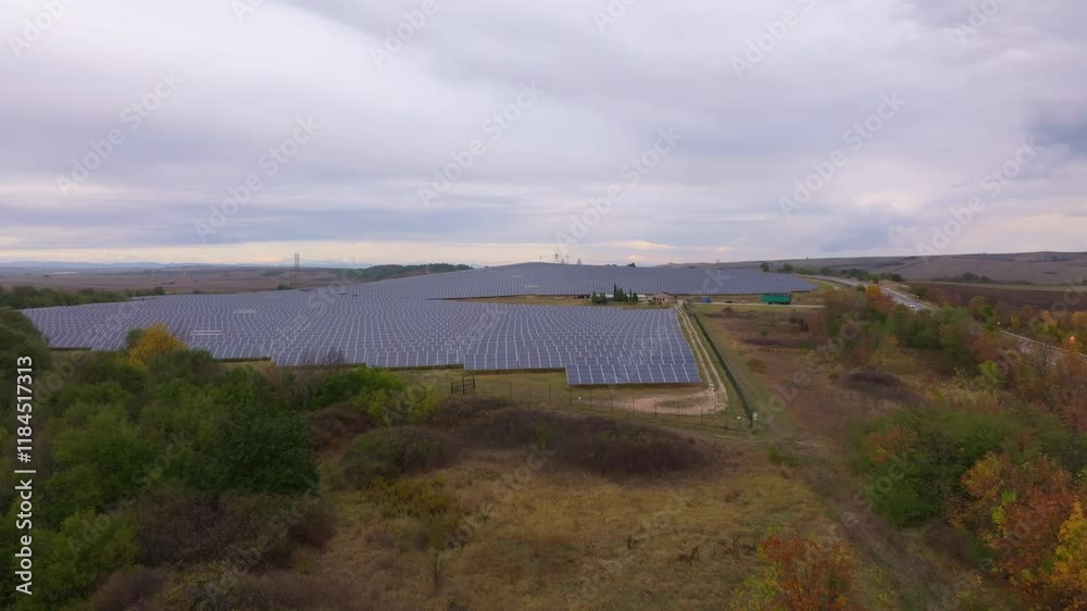 Aerial view of solar farm with photovoltaic panels in a beautiful landscape, Bryast, Bulgaria. Aerial view of solar farm with photovoltaic panels in a beautiful landscape, Bryast, Bulgaria.