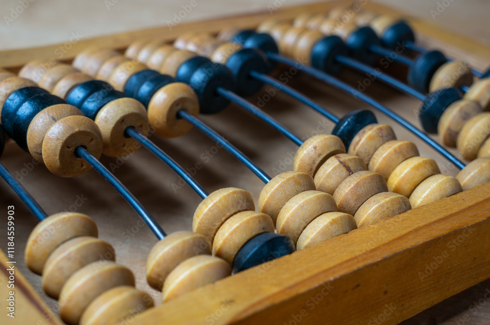 Old wooden abacus on a wooden table Old wooden abacus on a wooden table