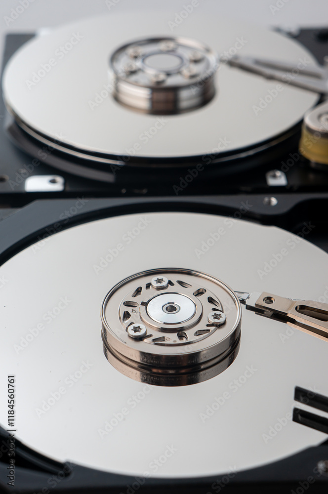 Close-up of the mechanisms of two hard drives Close-up of the mechanisms of two hard drives