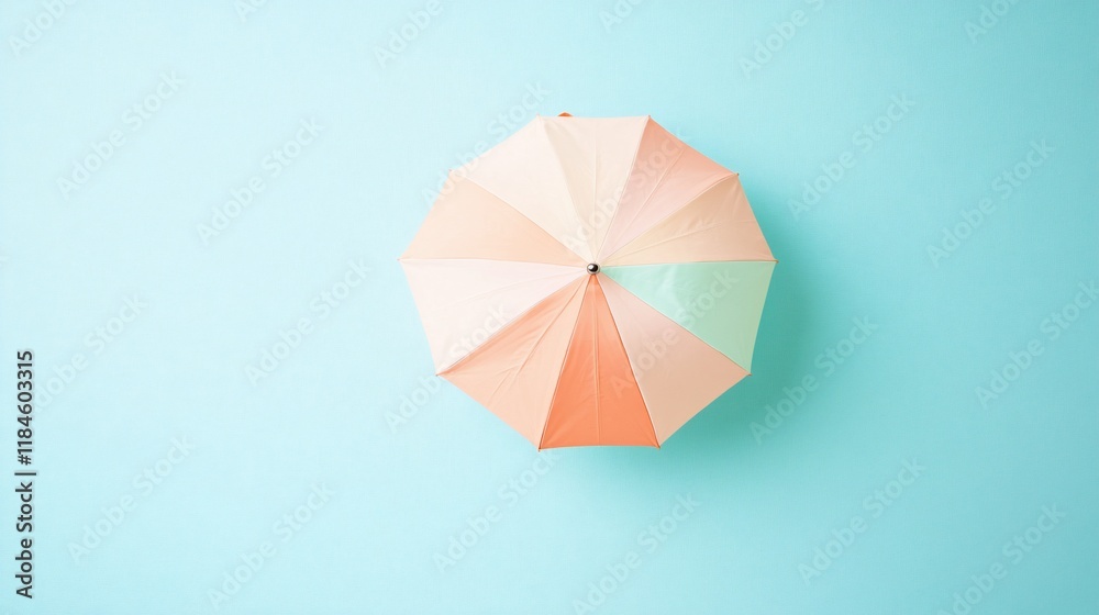 Pastel umbrella overhead view on blue background. Pastel umbrella overhead view on blue background.