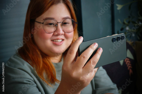 woman Work from home smiling Beautiful mature asian woman VDO call conference talk online on video call on laptop webcam with technology concept.