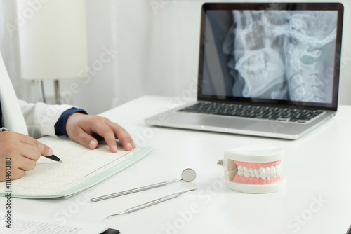 Dentist examining a patient teeth medical treatment at the dental office.