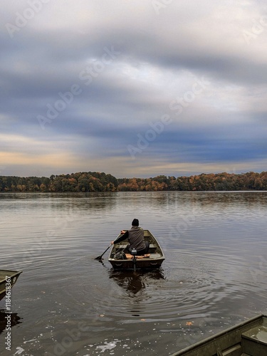 Jon boat on North Carolina lake with autumn trees