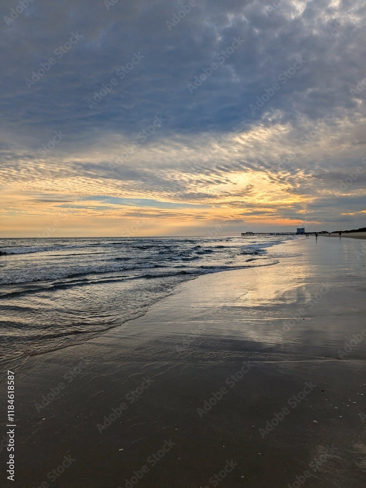 Sunset through the clouds over the ocean at Myrtle Beach, South Carolina Sunset through the clouds over the ocean at Myrtle Beach, South Carolina