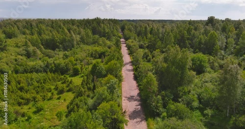 Aerial view of old Butterkula cobblestone road in rural Muhu in summer with clouds in the sky, Saaremaa, Estonia. photo