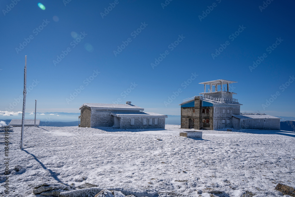 View of snowy landscape with Golyam Kademliya Shelter in the Balkan mountains, Gabrovo, Bulgaria. View of snowy landscape with Golyam Kademliya Shelter in the Balkan mountains, Gabrovo, Bulgaria.