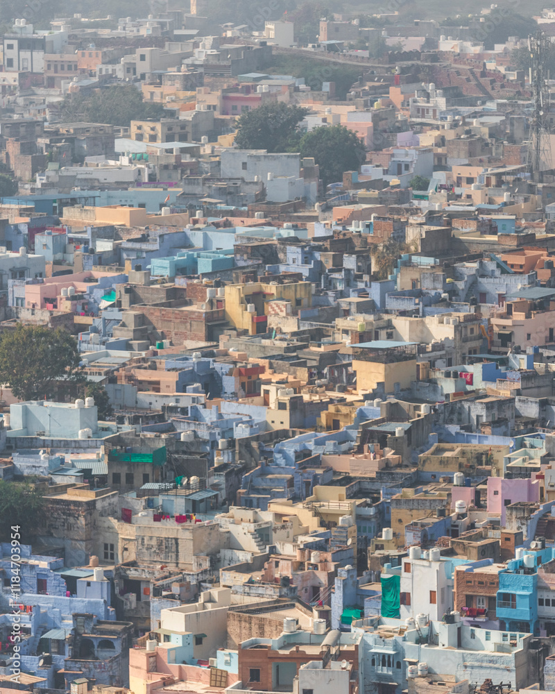 View of colorful and vibrant cityscape with bustling rooftops and traditional architecture, Jodhpur, India. View of colorful and vibrant cityscape with bustling rooftops and traditional architecture, Jodhpur, India.