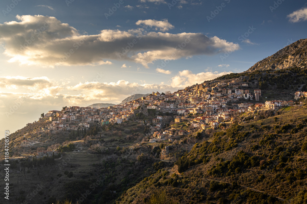 Sunset over Arachova city at Parnassus Mountain resort. Beautiful landscape with Arachova and its amazing architecture Greek constructions. Travel to Greece.