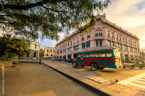 Road intersection with a view of a beautiful European neoclassical building. Wide view of the surroundings of Quetzaltenango's central park.