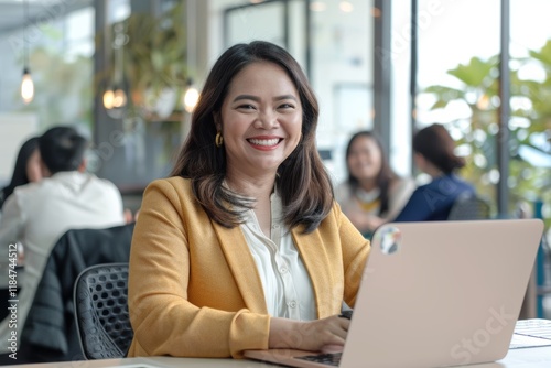 Free Download Professional woman engaged in a meeting, collaborating on ideas with a laptop, focusing on teamwork, project planning, and constructive feedback - GFXLoad