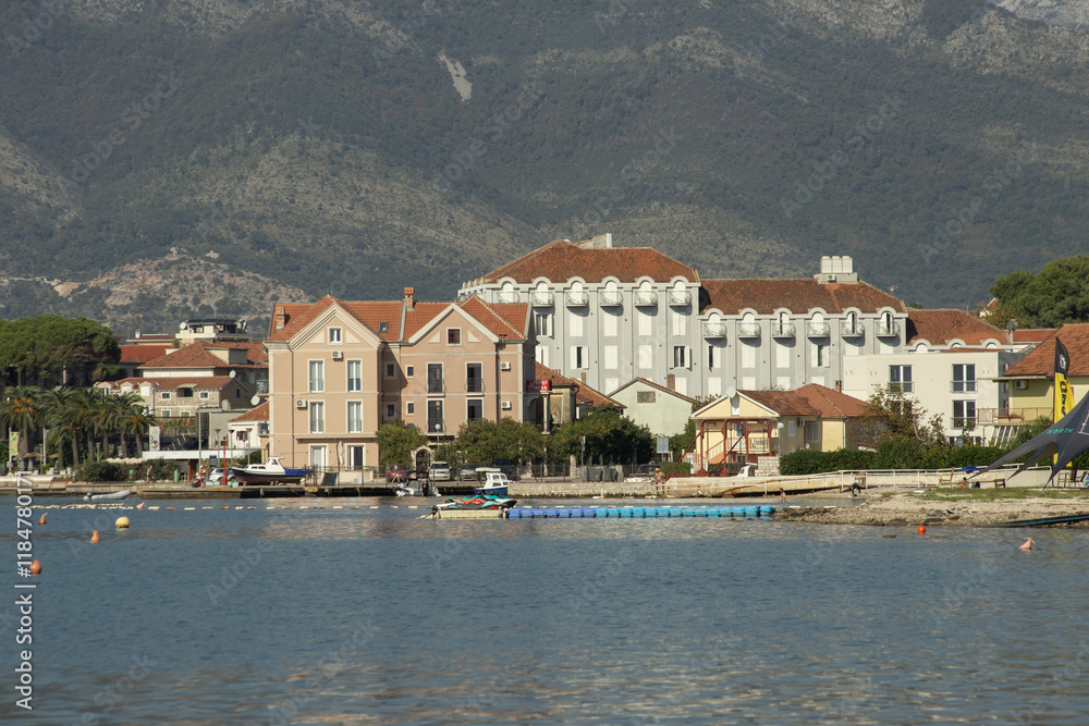 Typical view of the city of Budva, Montenegro from the sea, reflections of hotels in the water. High quality photo Typical view of the city of Budva, Montenegro from the sea, reflections of hotels in the water. High quality photo