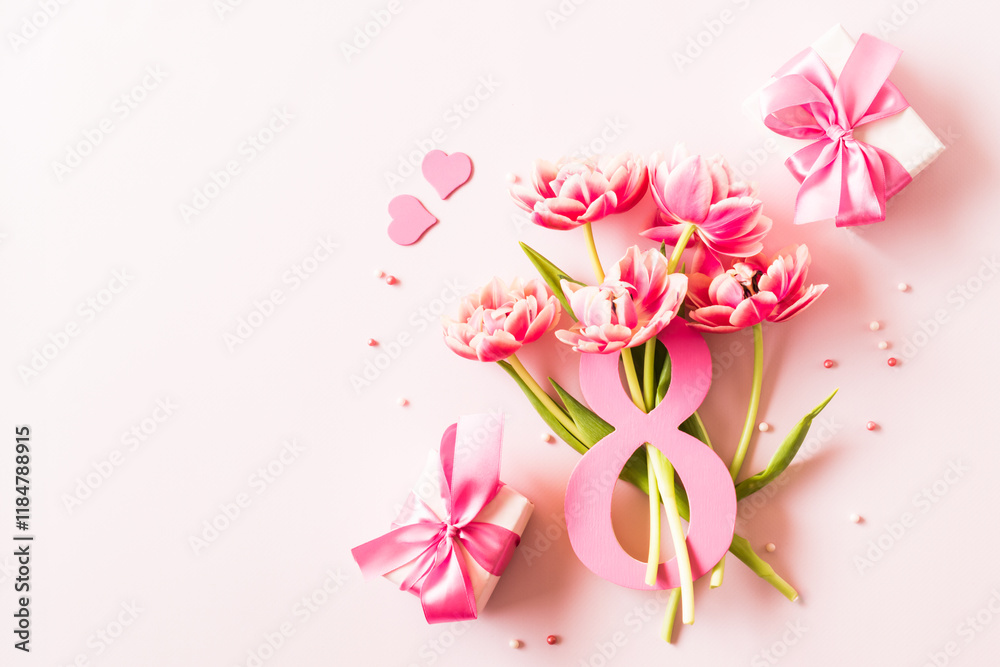 Fototapeta premium Number eight with bouquet of tulips on a pink background. International Women's Day concept