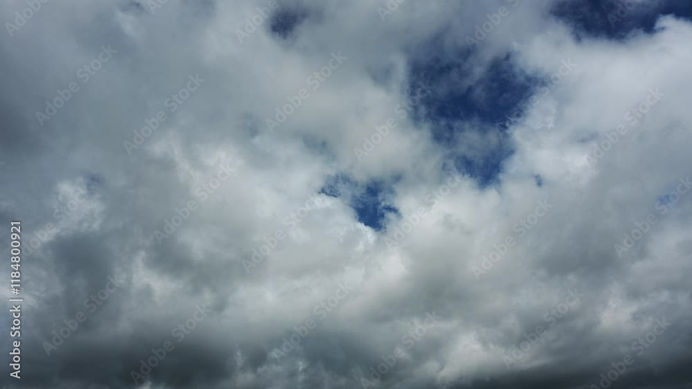 Time lapse of white and gray clouds moving through a dark blue sky
Time lapse of white and gray clouds moving through a dark blue sky