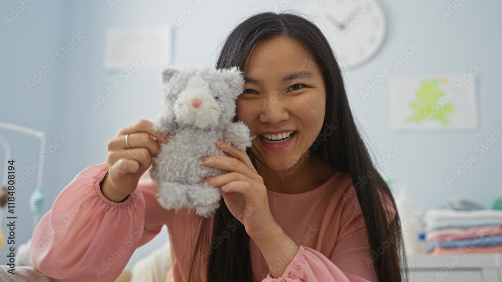 Woman smiling in a living room holding a stuffed toy, showcasing a cozy home environment with a playful and welcoming atmosphere. Woman smiling in a living room holding a stuffed toy, showcasing a cozy home environment with a playful and welcoming atmosphere.